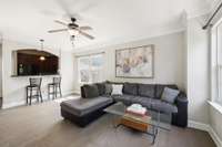 Living Room with Ceiling Fan. Artwork above the couch is virtually staged.