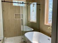 Beautiful tile shower with separate tub