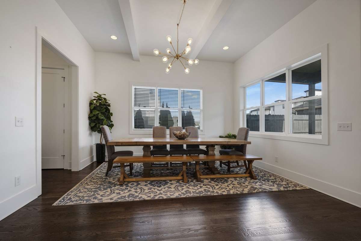 The dining room is set apart, offering ample space to comfortably seat 12—perfect for hosting your next special occasion meal or everyday dining. The garage entrance is to the left with a drop zone for coats/shoes/backpacks.