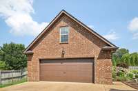 Detached custom built 2 car garage with floored attic above for tons more storage space!
