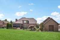 And check out the extended brick storage shed built onto the back of the detached garage! Great for your lawn tools & equipment or just whatever you need to store!