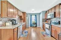 Beautiful kitchen with granite and tile backsplash.