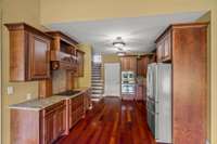 Kitchen with stairs leading to the bonus room.