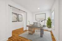 This flex space can be used as a home office.  The barn doors allow for privacy. The room has been virtually staged.