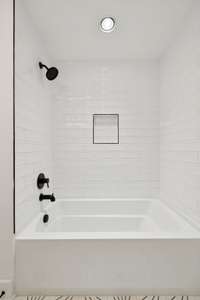 The main floor bathroom has a show/tub combo.