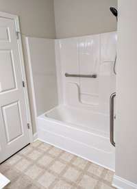 Guest bathroom with accessible bathroom features. Tub/shower combo.