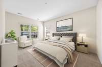 This picture depicts the primary bedroom, virtually staged.