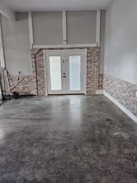 Owner converted three car garage to two car with an additional french door entrance