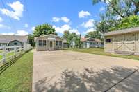 Private parking pad and entrance from gravel alley behind