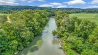 STUNNING Riverfront Property + Views!
6.95 Acres+/-