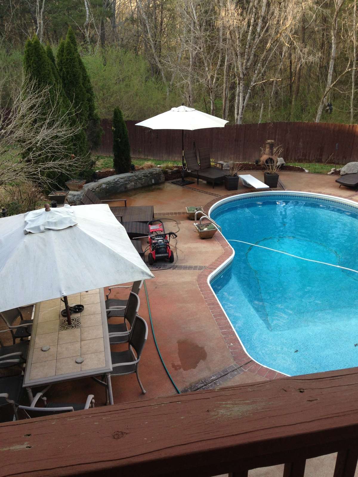 Covered back deck overlooking the pool.