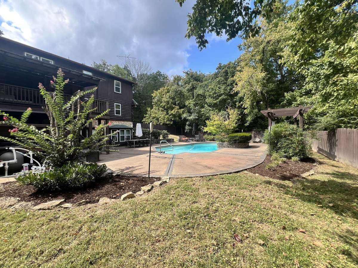 Gorgeous landscaping with pool, hot tub, and indoor sauna.