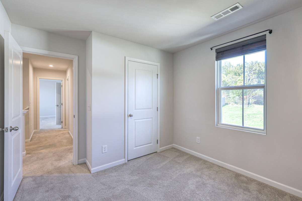 One of 4 bedrooms. This one has a large closet.