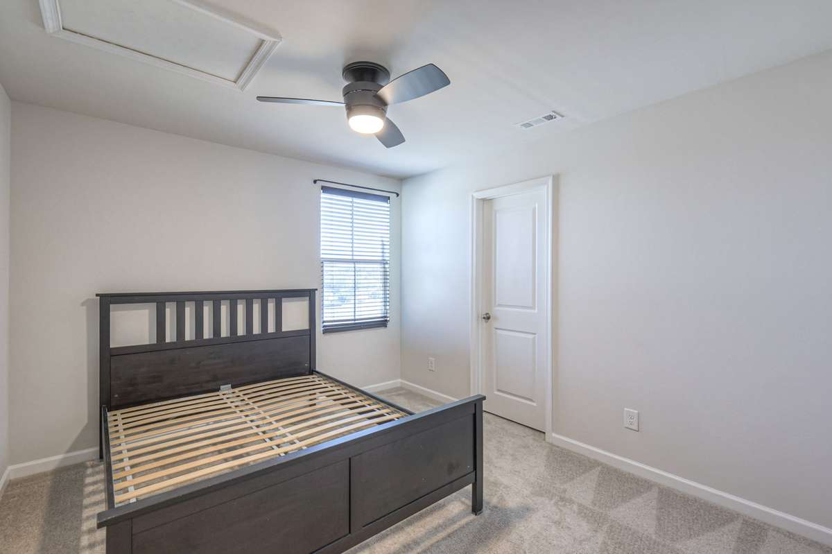 Guest bedroom with a walkin closet.