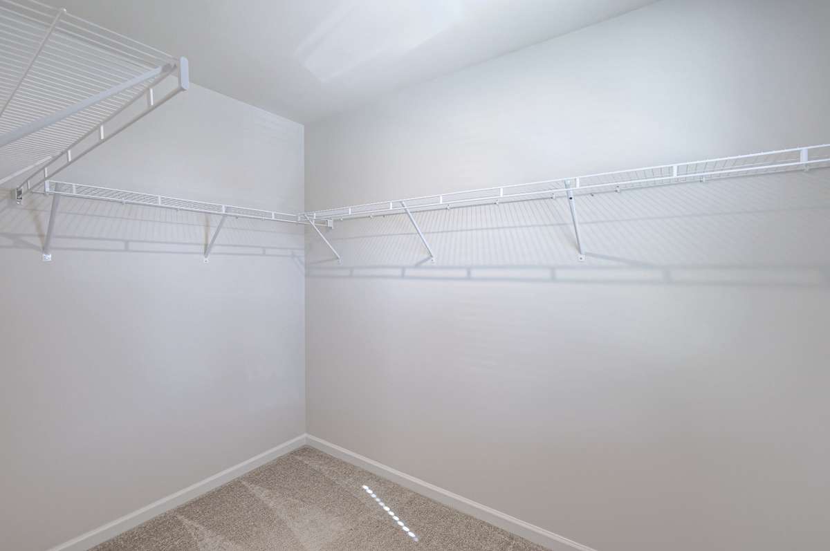 Large primary walk-in closet with a window (not pictured). Please note that this photo does not show how large the closet actually is.