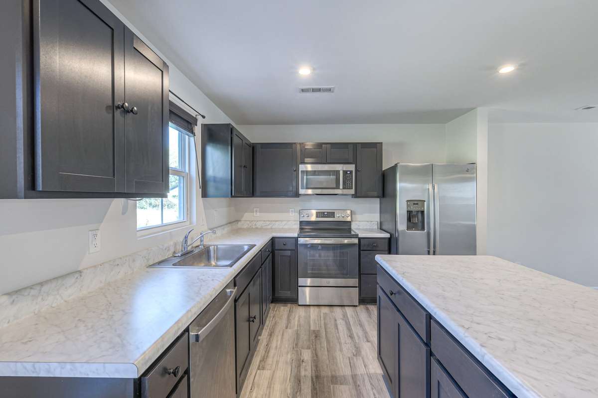The kitchen features all stainless steel appliances, which remain with the property.