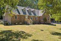 Classic Cape Cod Architecture with Brick Front & Sides