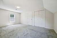 Upstairs Bedroom has windows to the side yard and backyard.