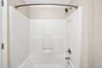 Full bath- tile flooring, tub/shoer combo