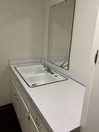 Utility room with a half bath.