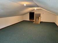 Over the garage bonus room.  Not heated or cooled.