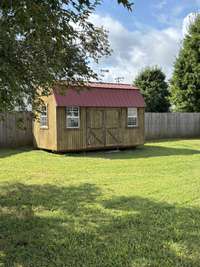Storage building remains with property.