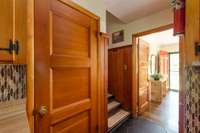 Kitchen views: left to the walkout basement, up the stairs to three bedrooms + a bath, and straight ahead into the family room/front door 