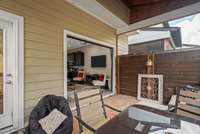 View from screened porch with garage door open into the main living area.