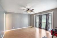 The primary bedroom has a big bay window.
