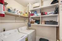Both clothes washer and dryer will convey with the property. There is more storage available in here, too!