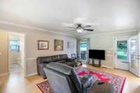 This view shows the location of the entry door from the backyard deck. To the left is the hallway leading to guest bath and guest bedrooms.