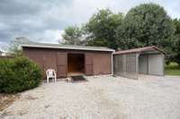 Here is the view of the larger shed. There is plenty of room to park!