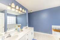 Double vanities in the primary bath.