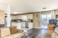 Living room, eat-in kitchen, open floorplan.