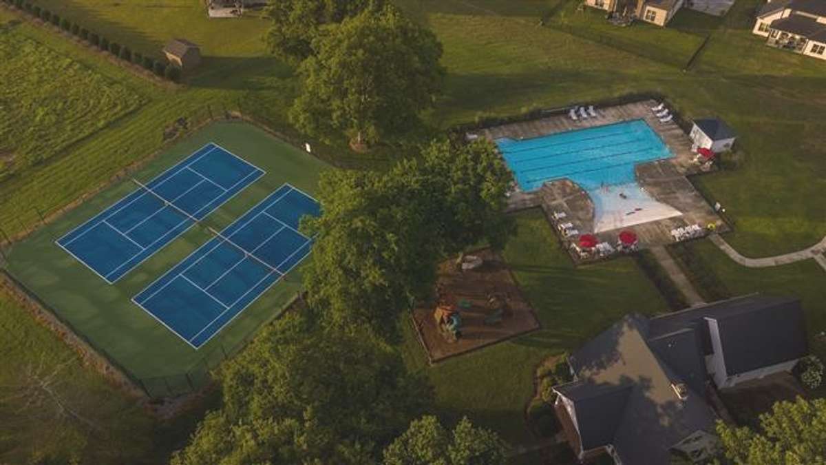 Community tennis/pickle ball courts, playground, clubhouse, pool
