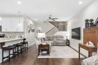 Family room has enough space for a large couch and tv and is open to the kitchen. Sit at the kitchen counter and enjoy your favorite shows.