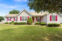 This large corner lot offers shade and green space.