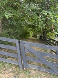 Trail through backyard fence
