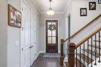 Welcoming foyer offers it’s own space before opening up to the living room