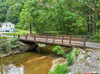 Bridge has electric to it. Current lighting is solar.