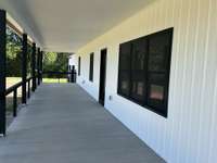 L side front porch with access to great room.