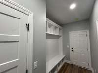Mud Room with access in back to garage and to opposite side laundry