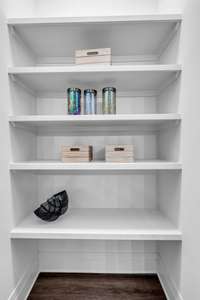 Spacious Walk-In Pantry with Custom Wood Shelving