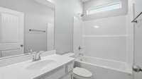 bathroom located between the 2 bedrooms upfront