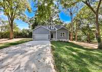 Beautiful new construction home situated on over half an acre with mature trees!