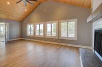 This open concept floor plan offers plenty of space to entertain. Custom plantation shutters through out