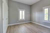 one of two bedrooms downstairs with large closet and built in blackout shades and plantation shutters