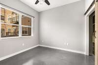 The Main bedroom features high ceilings and a large picture window for that pool view