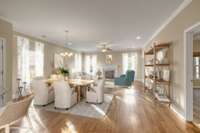 This VIRTUALLY STAGED photo gives you an idea of how the living room space could be used to make it your own!