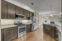 Gas Range? Check. Included fridge? Check. Extra cabinets for all your kitchen needs? You bet!